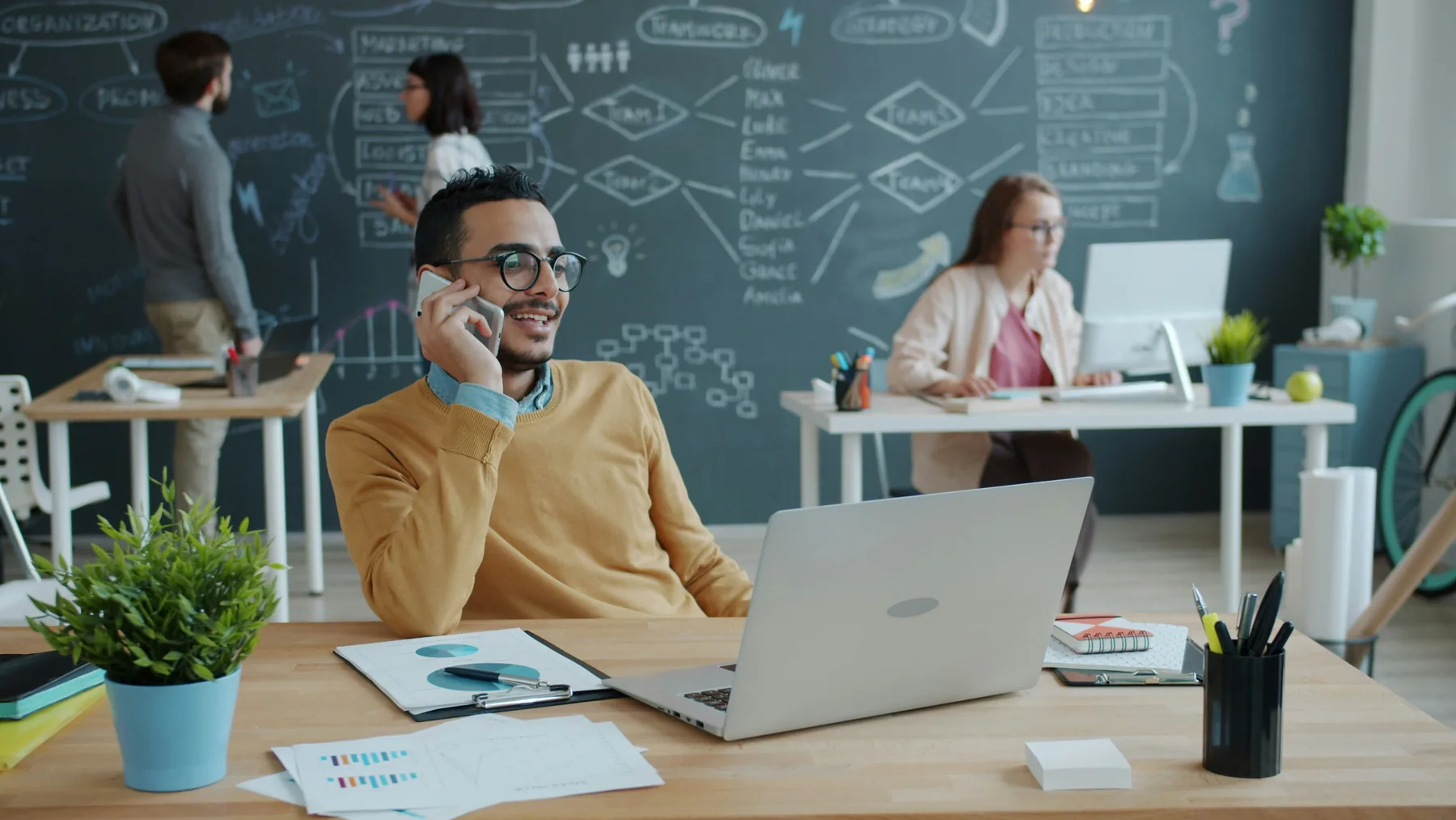 Professional speaking on a phone in a modern office